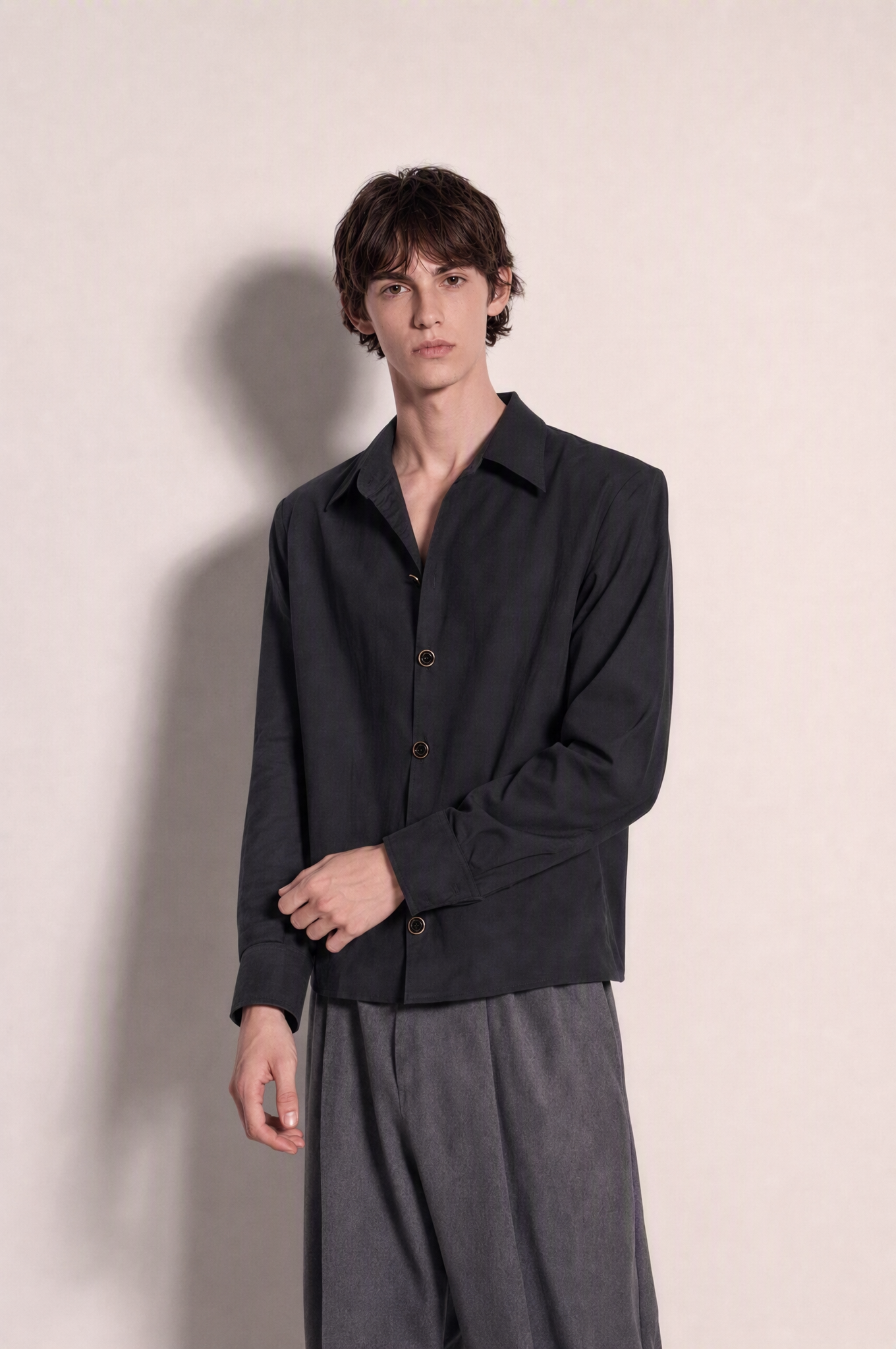 Structured Shoulder Pearlized Button Shirt in Black – three-quarter view