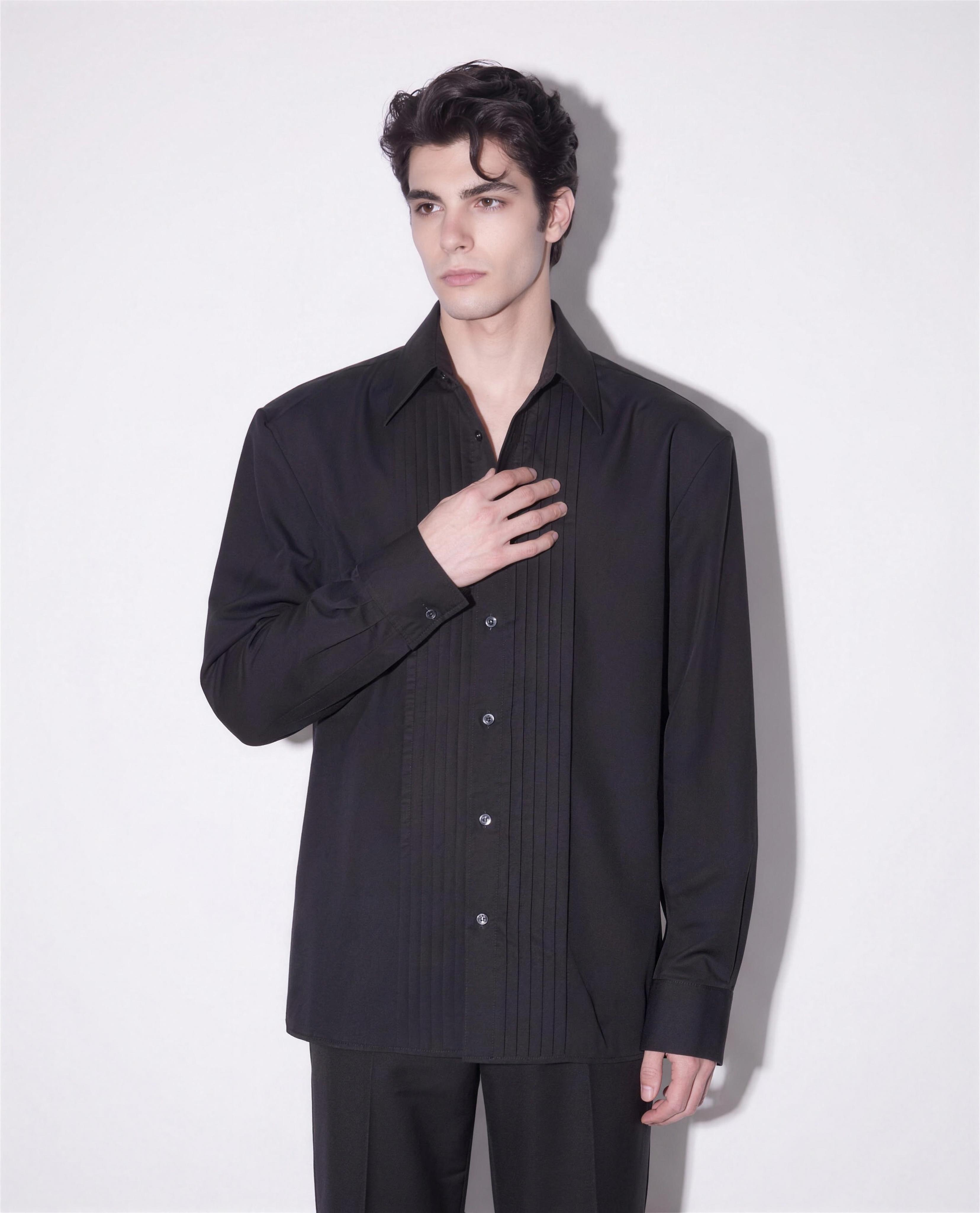 Boxy Pleated Front Pointed Collar Tuxedo Shirt in black worn untucked - half body view showing straight hem