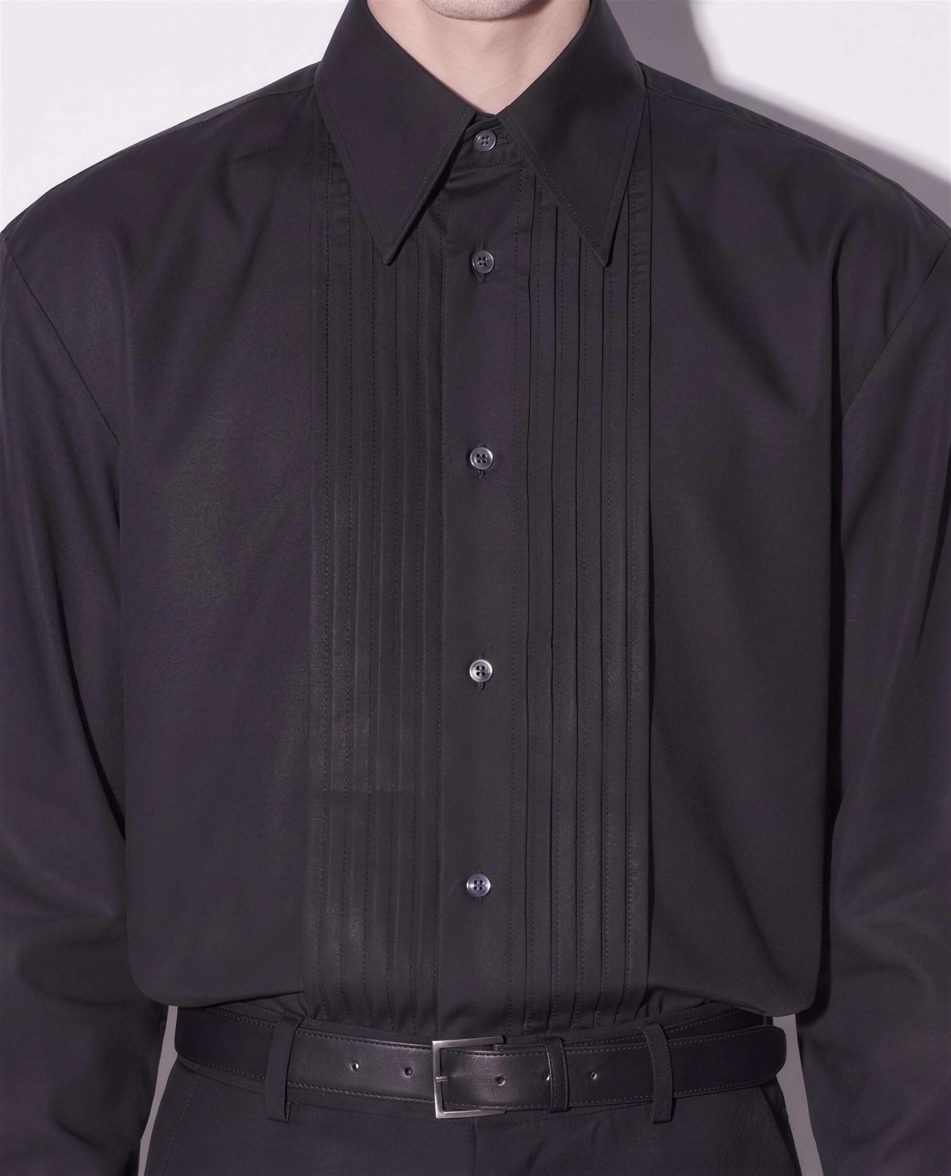 Boxy Pleated Front Pointed Collar Tuxedo Shirt in black - close up detail of vertical pleated front panel and pointed collar