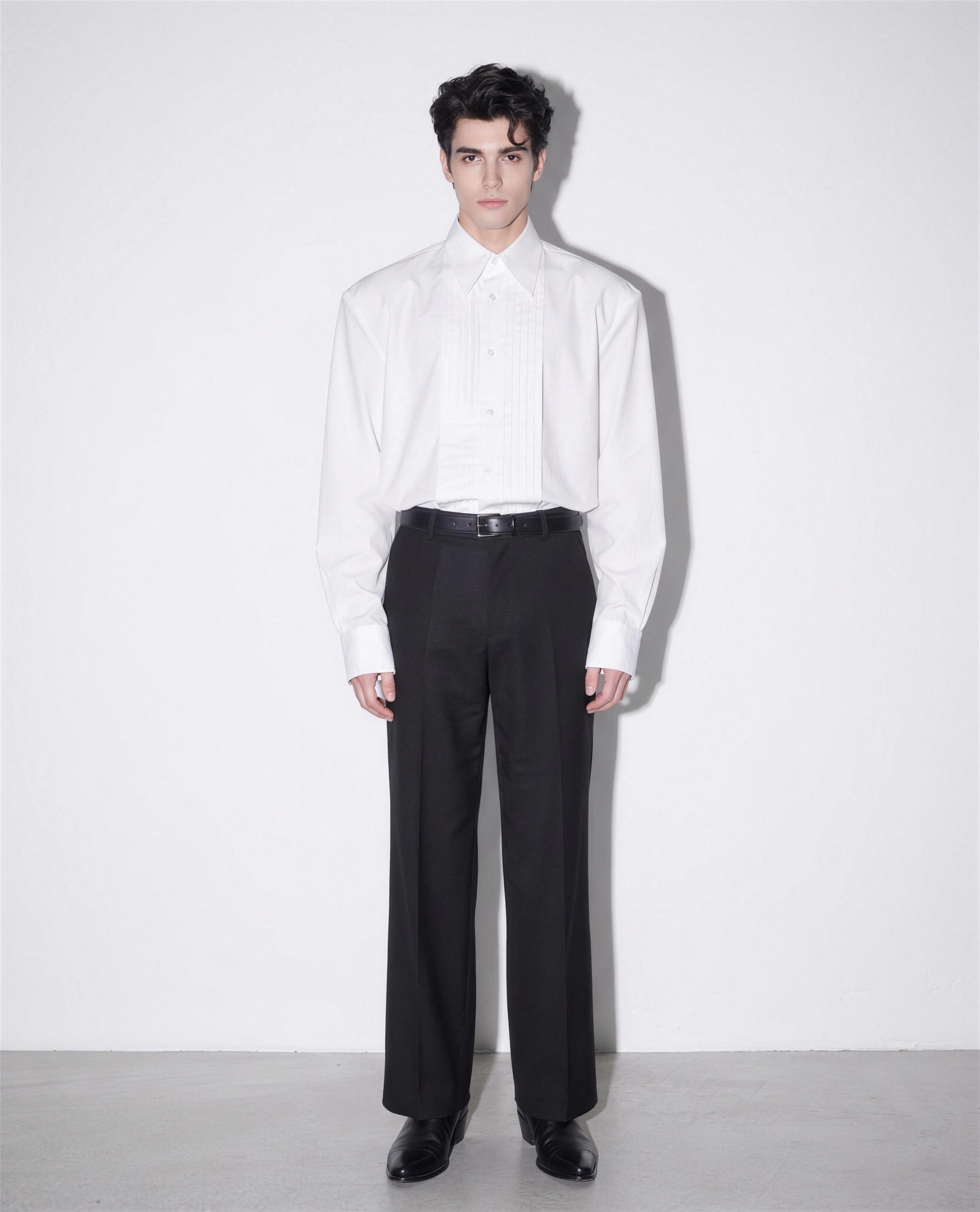 Boxy Pleated Front Pointed Collar Tuxedo Shirt in white, worn tucked with black wide-leg trousers - full body front view
