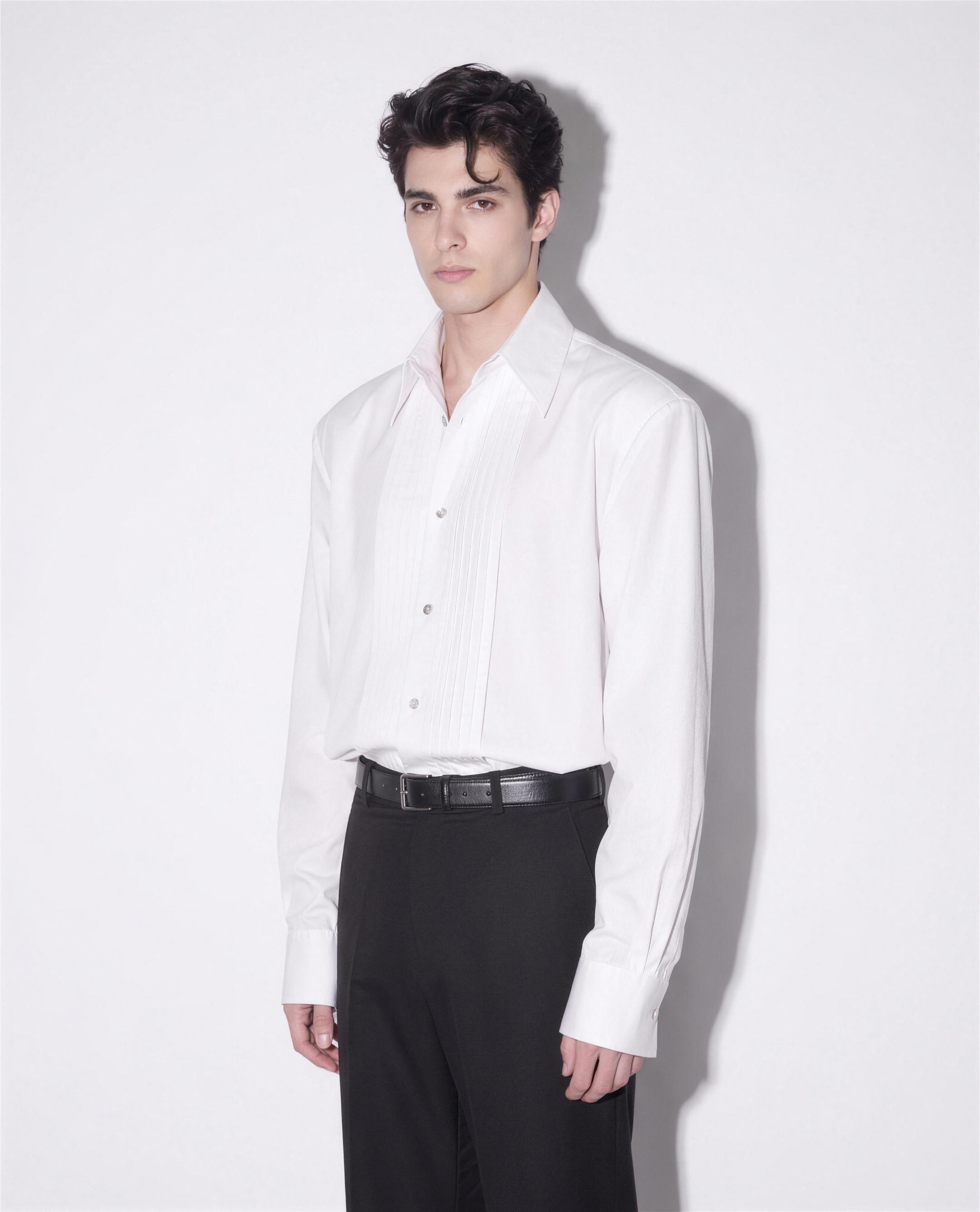 Boxy Pleated Front Pointed Collar Tuxedo Shirt in white - half body angled view showing boxy oversized fit