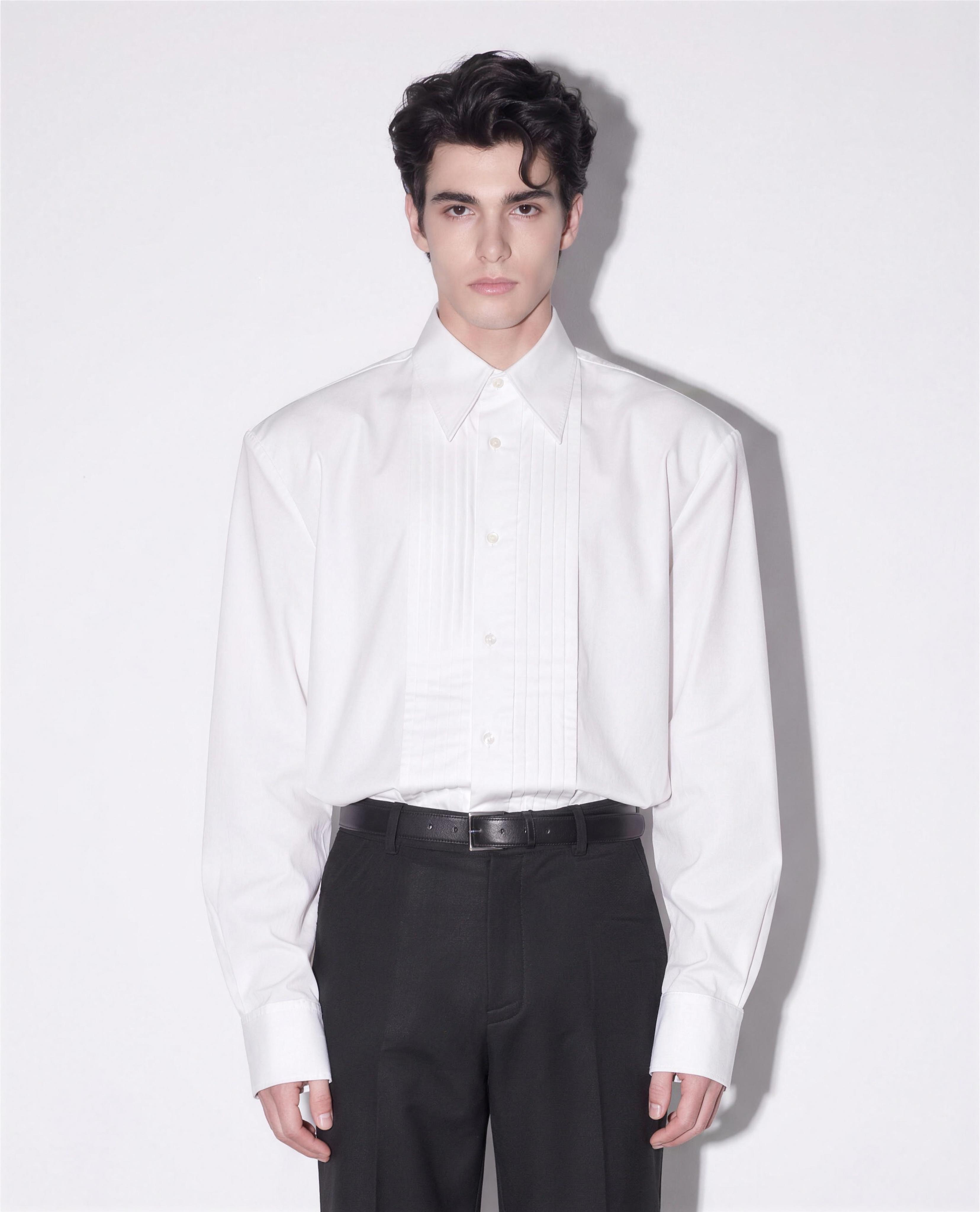 Boxy Pleated Front Pointed Collar Tuxedo Shirt in white - half body front view showing pleated bib and pointed collar