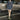 Houndstooth Cropped Blazer and Pleated Tier Hem Mini Skirt Two-Piece Set - nightcity clothing